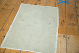 Reverse of Vintage Oushak rug, displaying hand-knotted foundation and blanched ivory color.