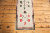 Lower part of Vintage Oushak runner with whimsical red geometric florals on pale ivory.