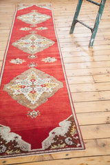Vintage Oushak runner with diamond-shaped medallion in bronze, ivory, saffron yellow, cherry red.
