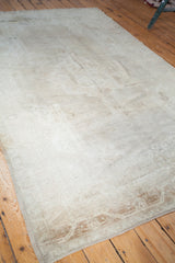 Plush vintage Oushak carpet pile showcasing subtle abrash with beige and gold tones.