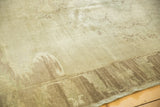Subtle grey earth tones and distinct charcoal-brown border on this vintage Oushak rug.