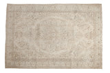 Faded vintage Oushak carpet with large ivory floral medallion and blanched mint border.
