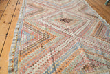 Detail of Vintage Jajim rug's soft pastel geometric pattern with stepped, staggered knotting.