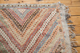 Close-up of vintage Jajim rug's textured stepped knotting and pastel diamond motifs.