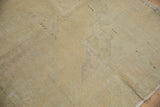 Back of the distressed Oushak carpet, displaying its natural woven foundation.