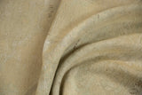 Hand-knotted woven backing of a distressed vintage Oushak carpet in natural beige.