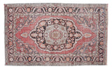 Vintage Oushak rug featuring a cinnabar red field with charcoal medallion and ornate border.