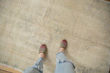 Soft, blanched tones and distressed texture of a vintage Oushak rug.