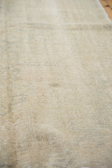 Airy, blanched hand-knotted pile texture on a distressed vintage Oushak rug.
