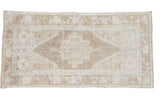 Vintage Turkish Oushak rug with a central geometric medallion in blanched bronzy tones, 3'8