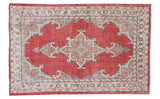 Bold vintage Oushak rug featuring a cherry red field and ivory slate grey medallion.