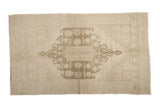 Light and airy vintage Oushak rug with ivory, beige, and sea foam green tone-on-tone medallion.