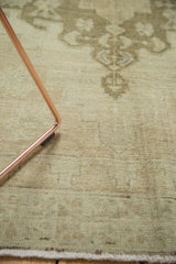 Tone-on-tone curvilinear pattern in sea foam green overcast vintage Oushak rug.