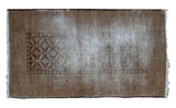 Distressed Belouch rug, muted brown with a ghosted serrated leaf geometric pattern, 3'1