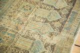 Distressed Belouch runner detail: soft green, antique ivory, charcoal brown tribal pattern.