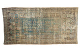 Antique Belouch runner, distressed geometric motifs in soft green, charcoal brown, and ivory, 3x5.8.