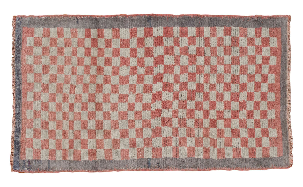 Vintage 1960s Tulu rug runner, coral and beige stepped checkerboard with grey border.