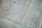 Hand-knotted pile texture of vintage Oushak rug in sandy beige and sea foam green.