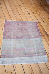 Vintage Oushak flatweave rug in reddish pink, sandy beige, and sea foam green horizontal stripes.