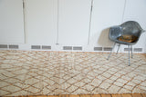 Pale ivory shaggy pile with apricot geometric diamonds on vintage Moroccan runner.