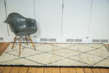 Vintage Moroccan runner rug with pale ivory shaggy pile and black lattice diamonds.