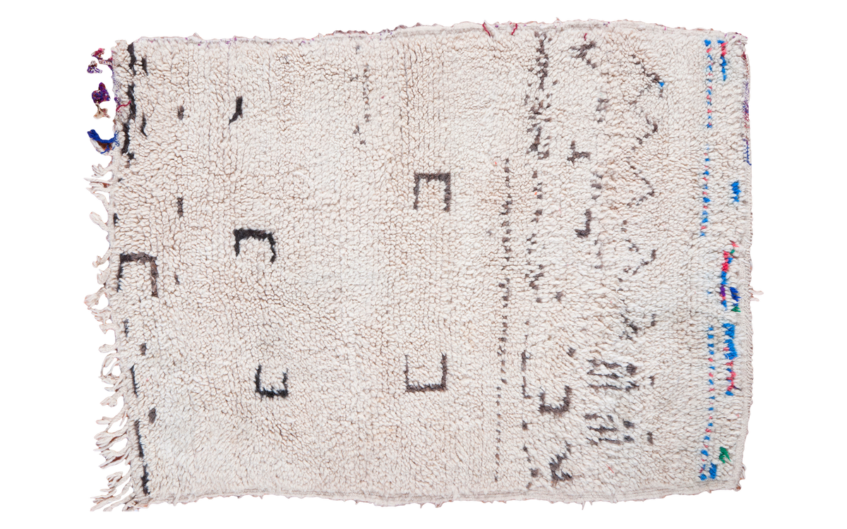 Shaggy cream vintage Moroccan rug with dark abstract patterns and vibrant striped border, 3x3'10.