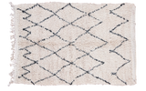 Vintage Moroccan rug, shaggy pale ivory pile with black lattice and mountain motif.