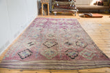 Textured vintage Moroccan runner: eggplant mauve field, grey medallion motifs, striped kilim end.