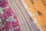 Plush eggplant mauve vintage Moroccan rug pile, grey design, and striped kilim end.