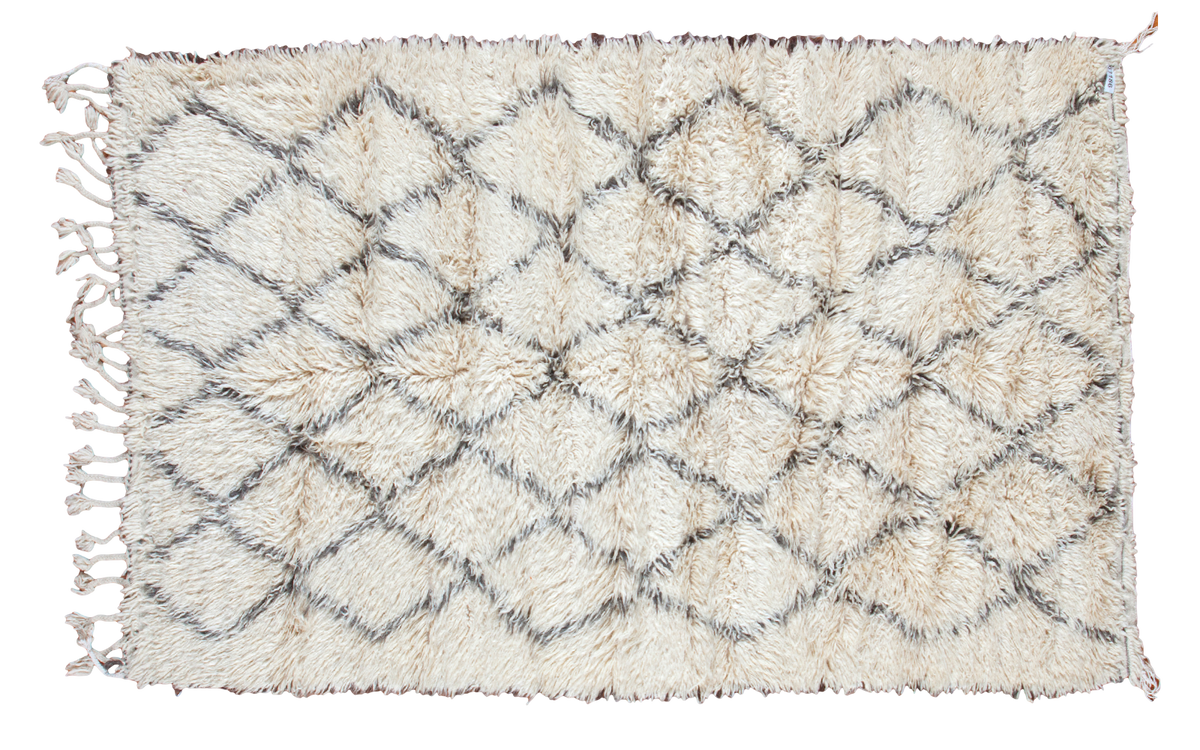 Fluffy ivory Beni Ourain Moroccan carpet with charcoal lattice pattern.