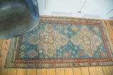 Vintage Anatolian Caucasian rug with aqua blue and beige geometric patterns, reddish border.