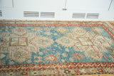 Geometric aqua blue patterns and subtle beige motifs on a vintage Anatolian Caucasian rug.