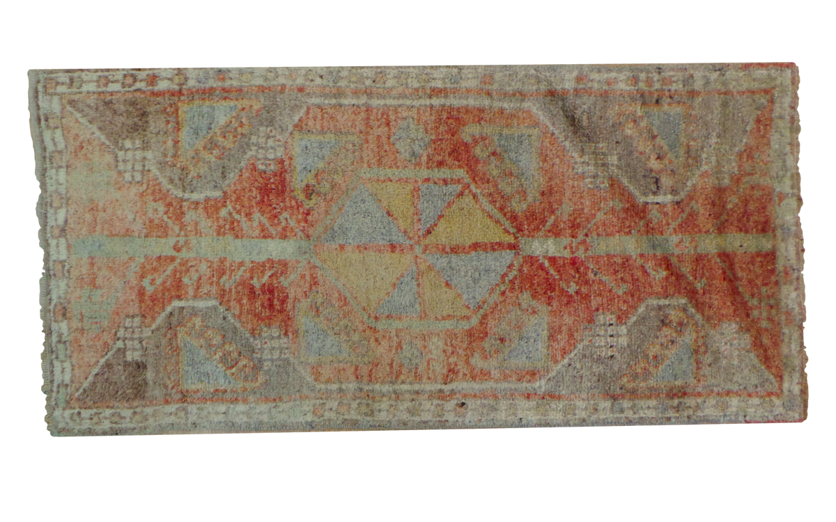 Vintage Oushak rug with geometric pinwheel medallion in rusty red, saffron, grey, and ivory.