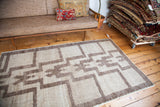 Vintage 1970s Tulu rug with repeating stepped germinating plant design in silver-gray.