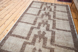 Textured pile of a vintage Tulu rug featuring a geometric stepped pattern in natural brown hues.