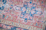 Vintage Karaja rug with bright red grapefruit, brilliant teal, and ivory geometric patterns.
