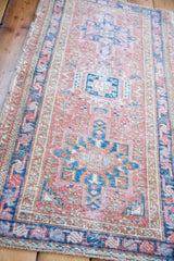 Geometric design of a vintage Karaja rug in red grapefruit, brilliant teal, and ivory.