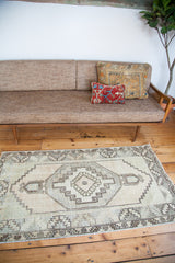 Hand-knotted vintage Oushak rug with stately geometric design in platinum, celadon, ivory, and beige.