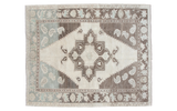Vintage Oushak carpet with geometric medallion, whimsical paisley, blanched ivory, pale mint, charcoal abrashes.