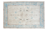 Vintage Oushak rug with platinum ivory allover field and pale aqua blue reciprocating border, 5'4
