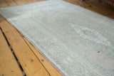 Detail of vintage Oushak runner showcasing muted peach, soft bronze, and ivory motifs.