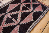 Vintage Kars rug featuring stepped-geometric pattern in grapefruit red and ivory tones.