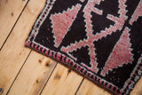 Vintage Kars rug detail: deep ground, grapefruit red stepped-geometric design, ivory border.