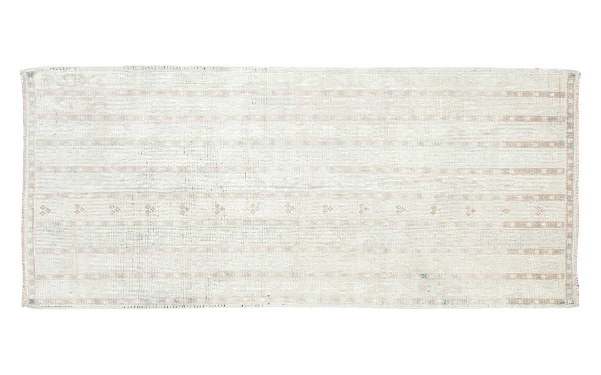 Vintage Tulu Rug Runner with pale blanched ivory and faded silver running water motif.
