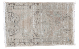 Decorative distressed vintage Oushak rug with soft tone-on-tone shades, subtle medallion.
