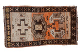 Vintage Turkish Oushak rug with geometric patterns in tangerine orange, ivory, grey, charcoal brown.
