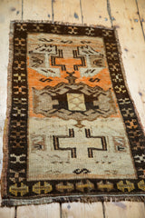 Detail of vintage Turkish Oushak rug corner, charcoal brown border, tangerine and ivory motifs.