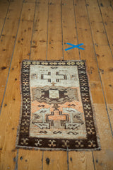 Vintage Oushak mat, strong geometric patterns in tangerine orange, ivory, grey, and charcoal.