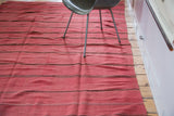 Soft wool cranberry red vintage Moroccan Kilim flatweave runner with thin dark stripes.