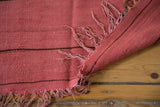 Vintage cranberry red Moroccan Kilim rug, flat weave texture, fringes, and reversible construction.